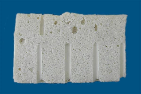Cut section through a polyurethane flexible foam block showing the open cell structure